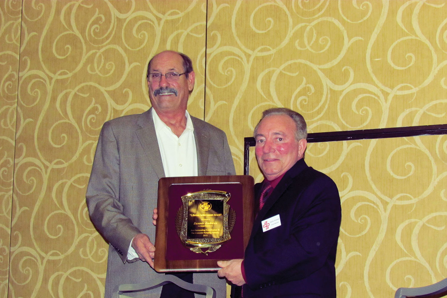 Dennis Andrews, receives the ACPA Lifetime Achievement Award from Mike Cusack (2012)