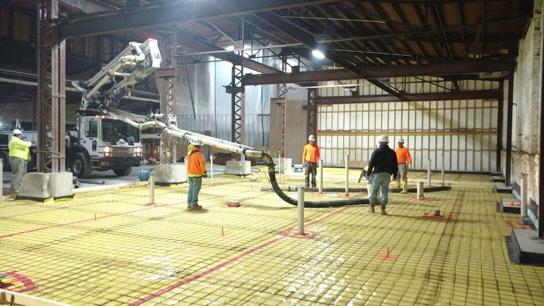 boom pump pouring concrete indoors
