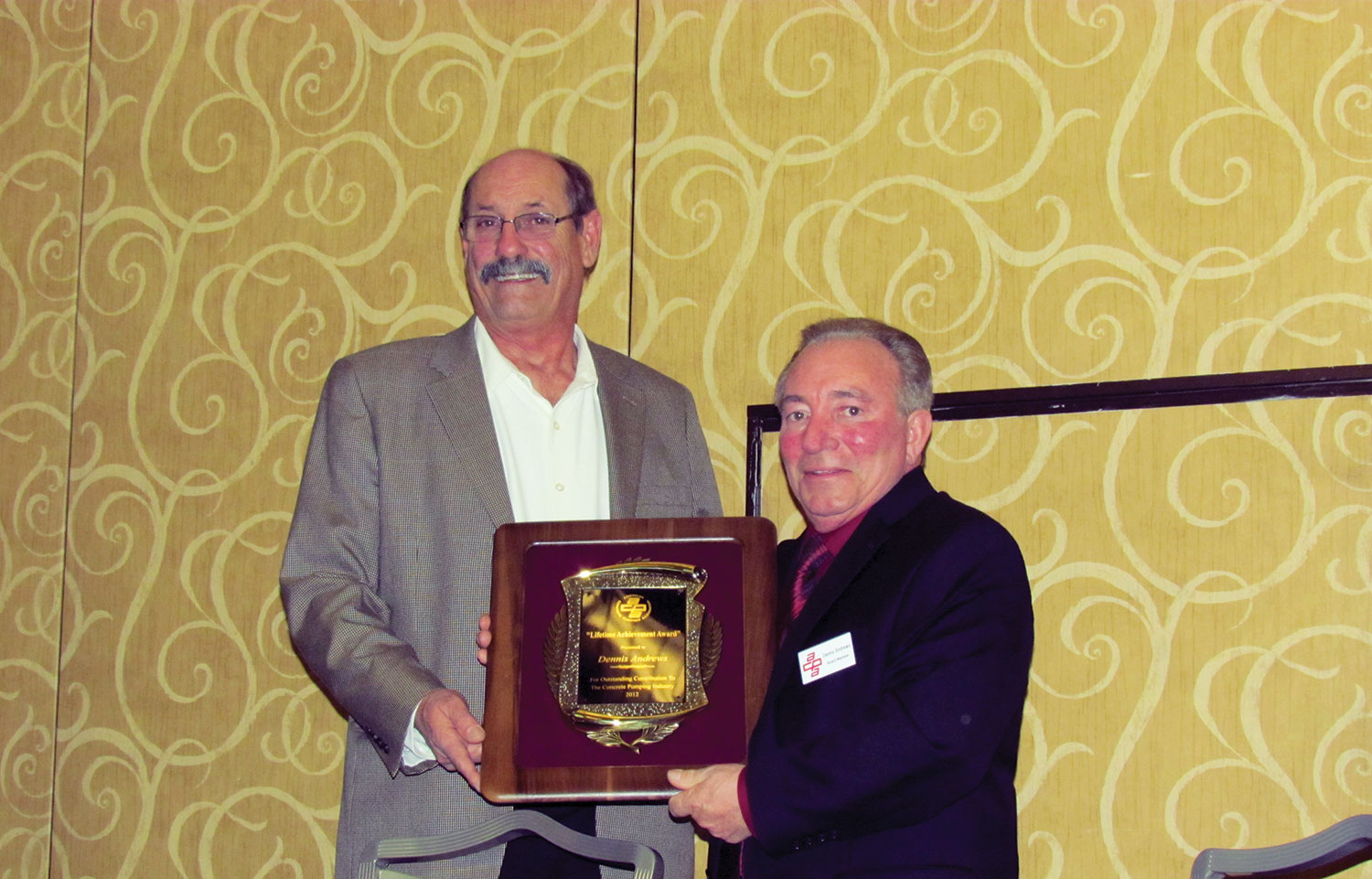 Dennis Andrews, receives the ACPA Lifetime Achievement Award from Mike Cusack (2012)