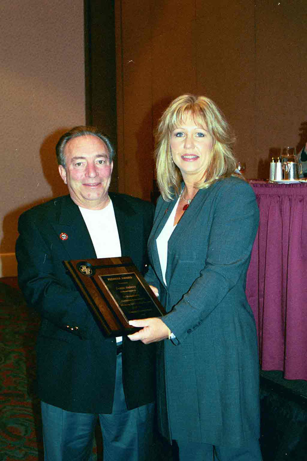 Founder, Dennis Andrews, receives the ACPA Pioneer Award from ACPA Executive Director, Christi Collins.(2004)