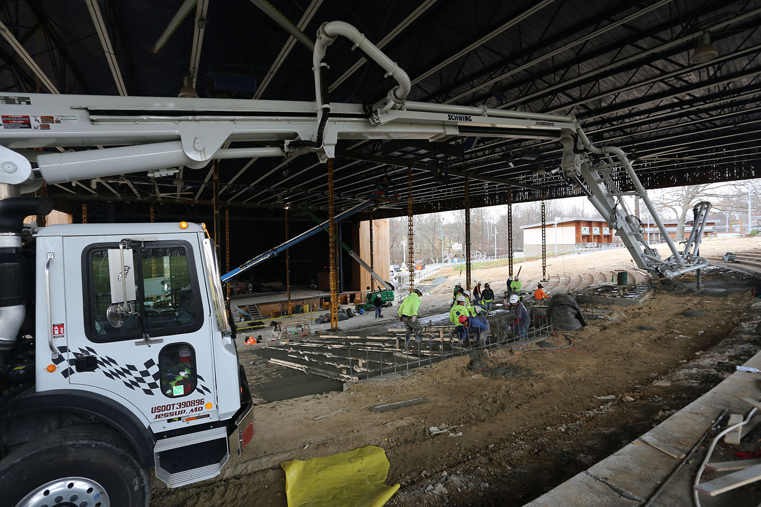 boom pump pouring concrete on a job site