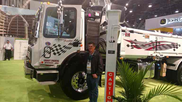Pump operator, Hector Diaz, celebrates his 10 year anniversary at Andrews with a brand new 31 meter showcased at World of Concrete (2017)